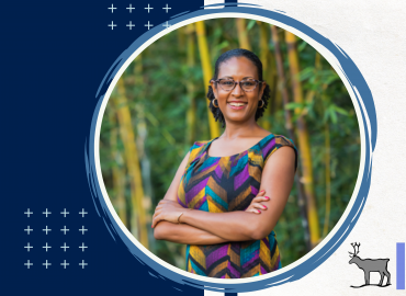 Professional headshot of the speaker of this seminar, Jade S. Sasser. She is smiling and slightly laughing towards the camera infront of a blurred nature background of a bamboo forest.