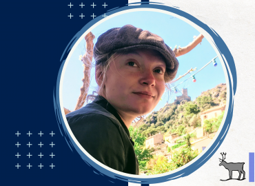 Headshot of Seminar Speaker Roxana Suehring in front of a scenic cliff