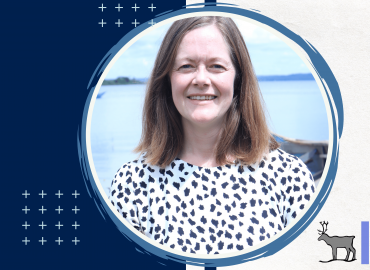 Professional headshot of the speaker of this seminar, Kathryn Fiorella. She is smiling towards the camera infront of a lake.